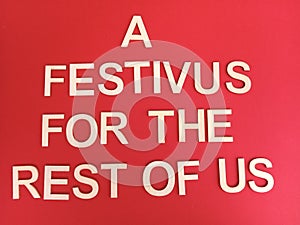 A festivus for the rest of us message on a festive red background photo