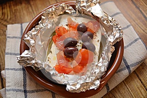 FETA CHEESE BAKED GREEK FOOD TRADITIONAL WITH OLIVA ORIGAN OIL TOMATO