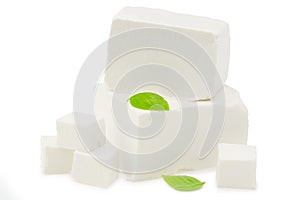 feta cheese with basil isolated on white background. Clipping path and full depth of field