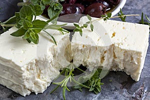Feta Cheese with Black Olives and Fresh Herbs photo