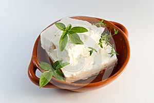 Feta cheese on brown plate photo