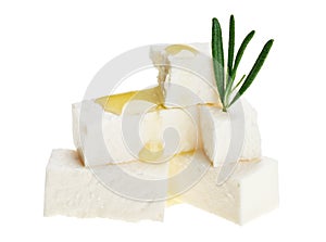 Feta cheese cubes with rosemary twig and oil drops