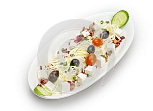 Feta cheese cut in cubes, vegetables, herbs and olives