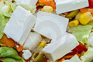 Feta cheese in a fresh mixed salad