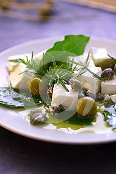 Feta cheese with olives and oil