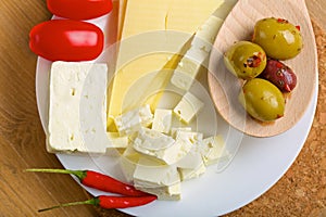 Feta cheese, olives and tomatos on a plate