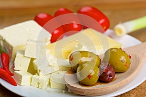 Feta cheese, olives and tomatos on a plate