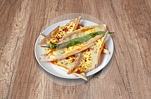 Feta Cheese Pide and vegetables on wooden table