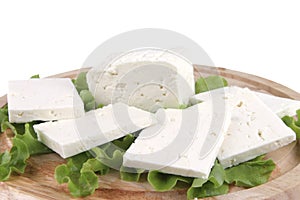 Feta cheese on wooden plate