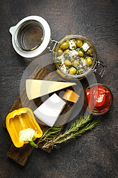 Feta with olives marinated in olive oil with spices and sun-dried tomatoes