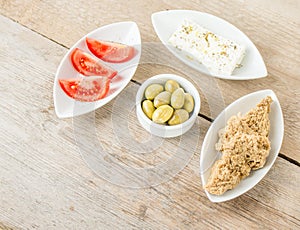 Feta, olives, tomatoes and rusks. Greek healthy food.