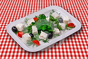 Fetta cheese with tomatoes, black olives and vegetables