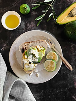 Fetta lime & avocado toast drizzled with olive oil photo