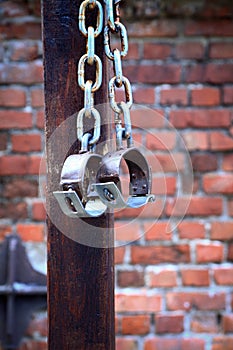 Fetters, manacles on brick background