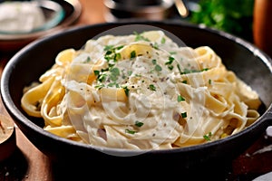 Fettuccine Alfredo - Wide egg noodles tossed in a rich and creamy Parmesan cheese sauce