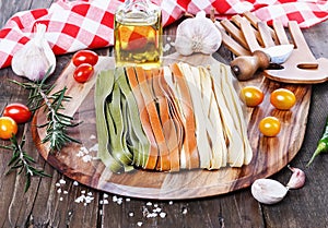Fettuccine over rustic wooden background