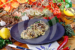 Fettuccine pasta in cream sauce with meat on a plate