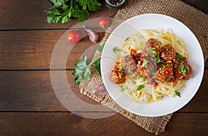 Fettuccine Pasta with meatballs in tomato sauce.