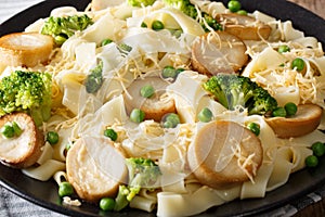 Fettuccine pasta with mushrooms king oyster, broccoli and peas c