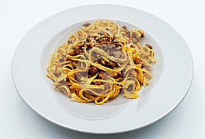 Fettuccine with ragu bolognese and parmesan isolated on white. Italian pasta