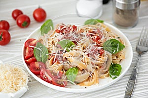 fettuccine with tomato sauce, parmesan and basil
