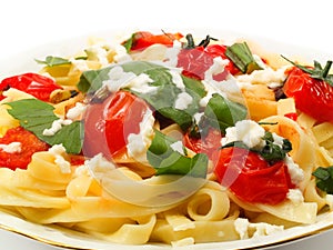 Fettucini with tomatoes and mozzarella photo