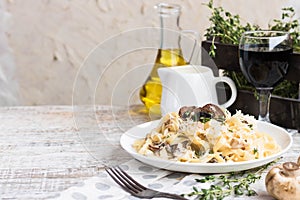 Fetuchini alfredo with mushrooms and chicken ham in creamy cheese sauce