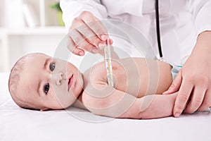 Fever, measuring temperature for little boy