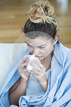 Feverish woman with tissue