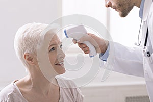 Fevers measure forehead by infrared for patient in clinic