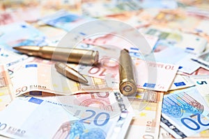 Few bullets over the pile of money