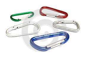 A few carabiners of different sizes and colours against a white backdrop photo