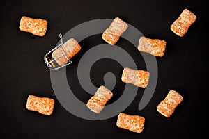 A few champagne or wine corks on a black background. Background and texture