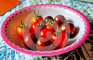 Few cherry tomatoes in a bowl