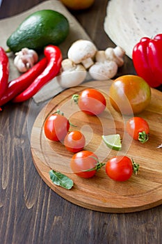 Few Cherry tomatoes on a wooden board