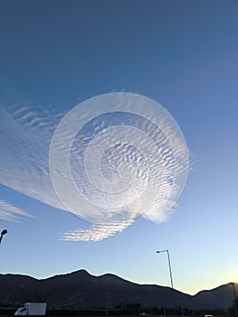 A few clouds in this blue afternoon sky