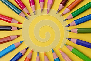few colored pencils on a yellow-blue background Develop creativity Get creative