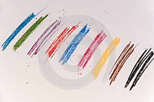 A few colored traces on a light background from pastel crayons