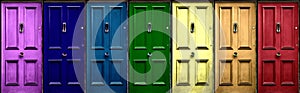 A few colorful doors in vintage style as a banner. Pink, navy blue, blue, green, yellow, orange, red door