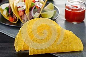 Few deep-fried corn tortillas. Cripsy base ingredient for hard-shell tacos
