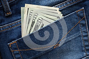 A few dollars in the back pocket of jeans, beware of pickpockets concept