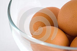 Few eggs in glass bowl