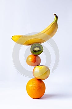 a few fruits stand brug on top of each other