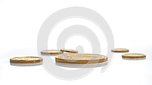 A few gold coins fineness 999.9 of various sizes are isolated on a white background