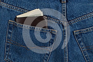 A few hundred dollars banknotes in a jeans pocket in your wallet. The concept of wealth and salary for work