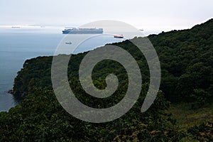 Few nautical ships in a harbor at early morning.