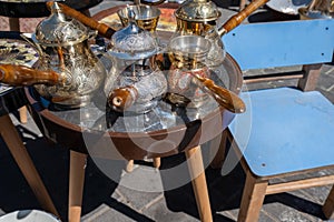 A few ornamented turkish coffee turk or cezve displayed at flea market