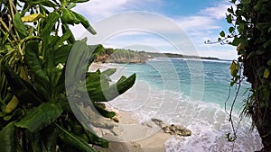 Few palm trees over tropical lagoon with white beach. Paradise island Nusa Lembongan, Bali, Indonesia. Blue water and