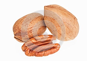 Few pecan nuts, one cracked