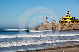 Few people enjoying the early day in Todos Santos beach in Baja California, Mexico